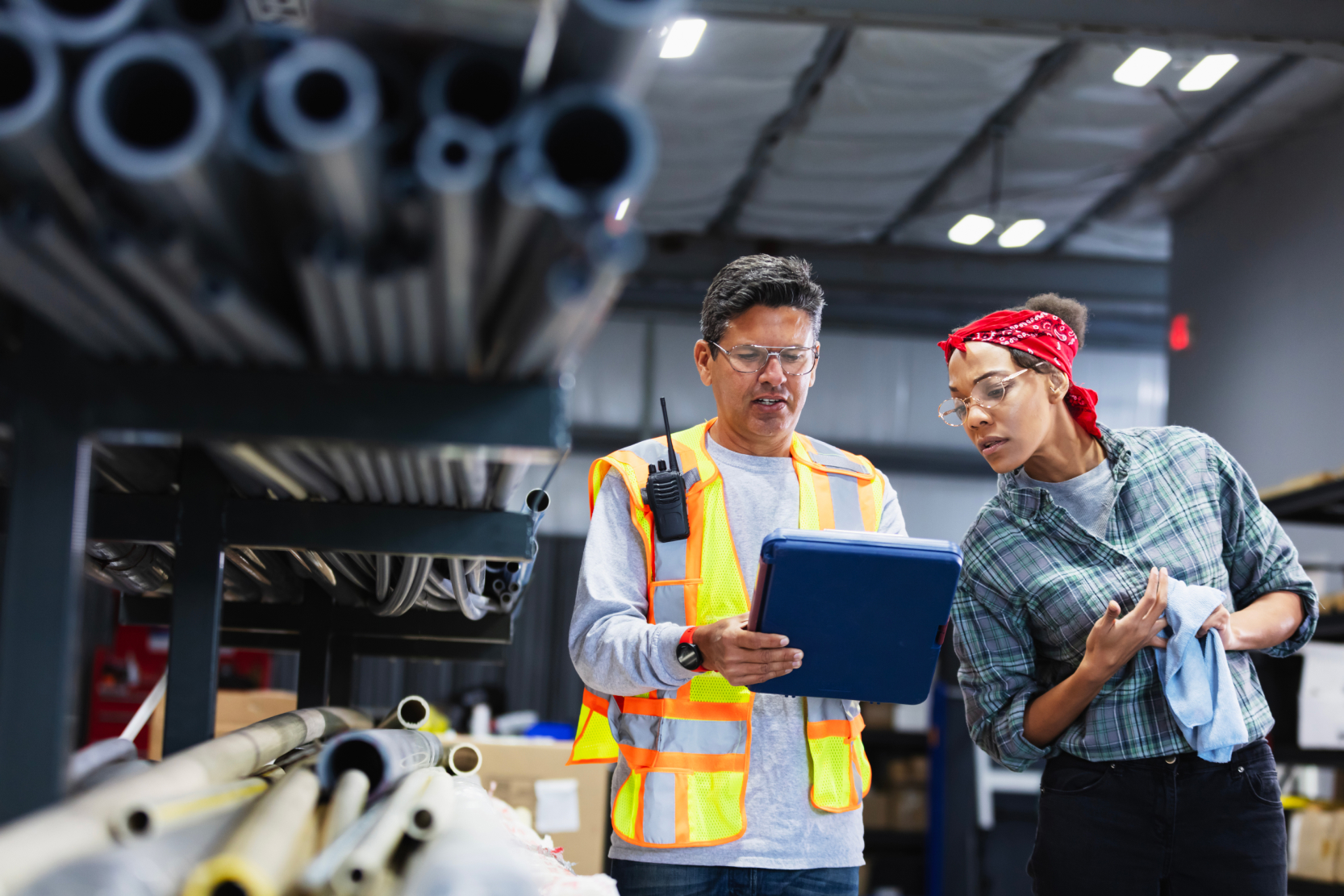 two people wearing glasses in warehouse