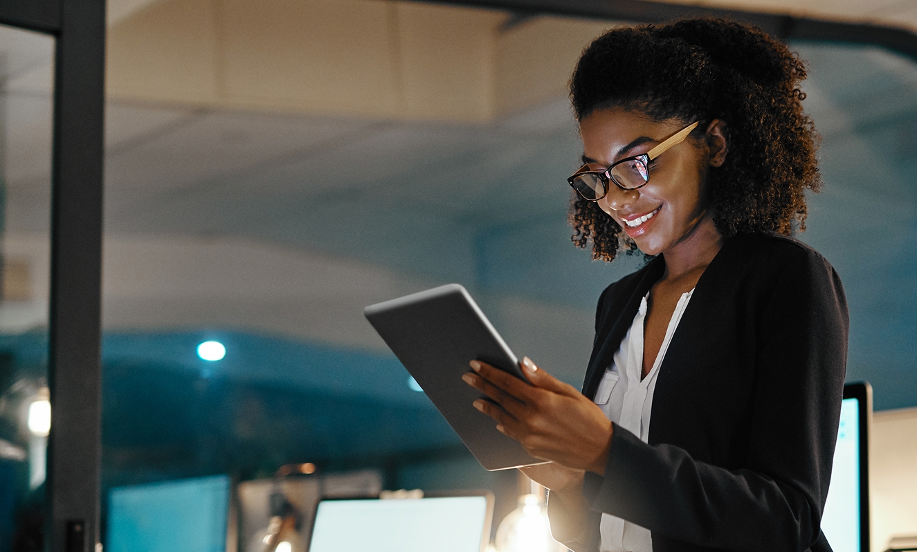 woman with glasses holding phone