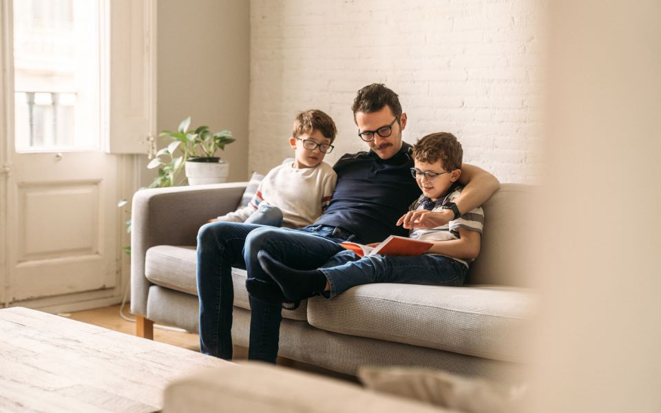 family reading on a couch