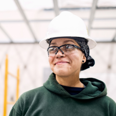 woman with glasses smiling