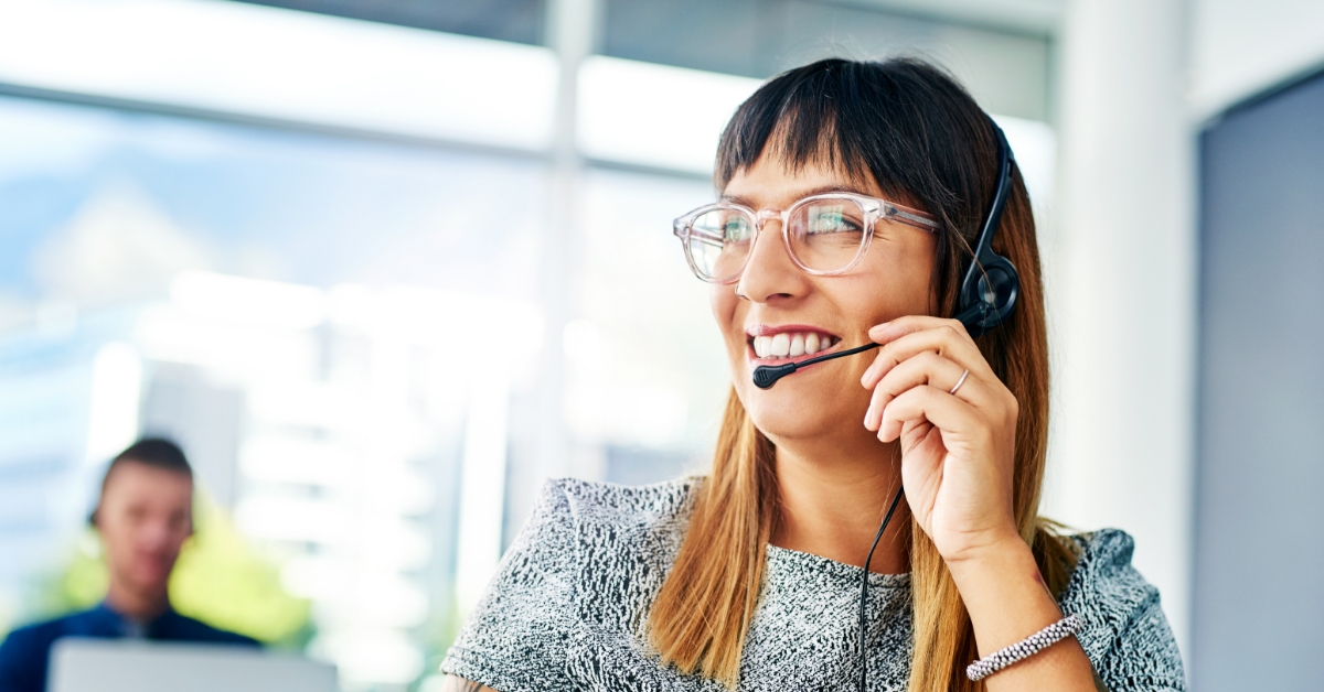 woman with glasses smiling