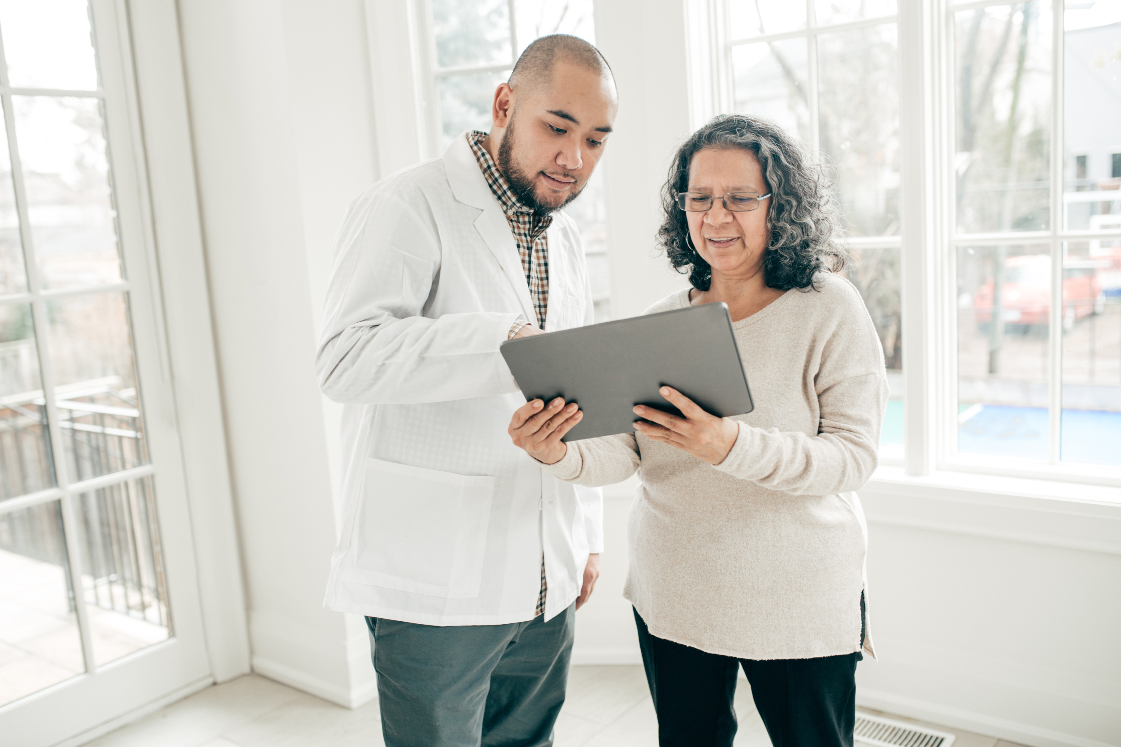 doctor and patient reviewing offerings